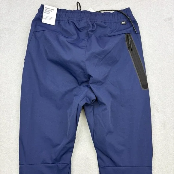 Nike Pants Mens Small Navy Sportswear Tech Essentials Commuter Woven Tapered Zip